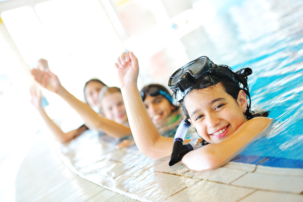 Kids in pool swimming