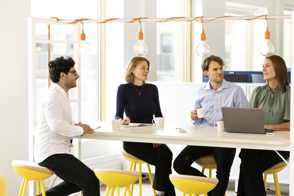 People in work situation, high chairs, orange lamps